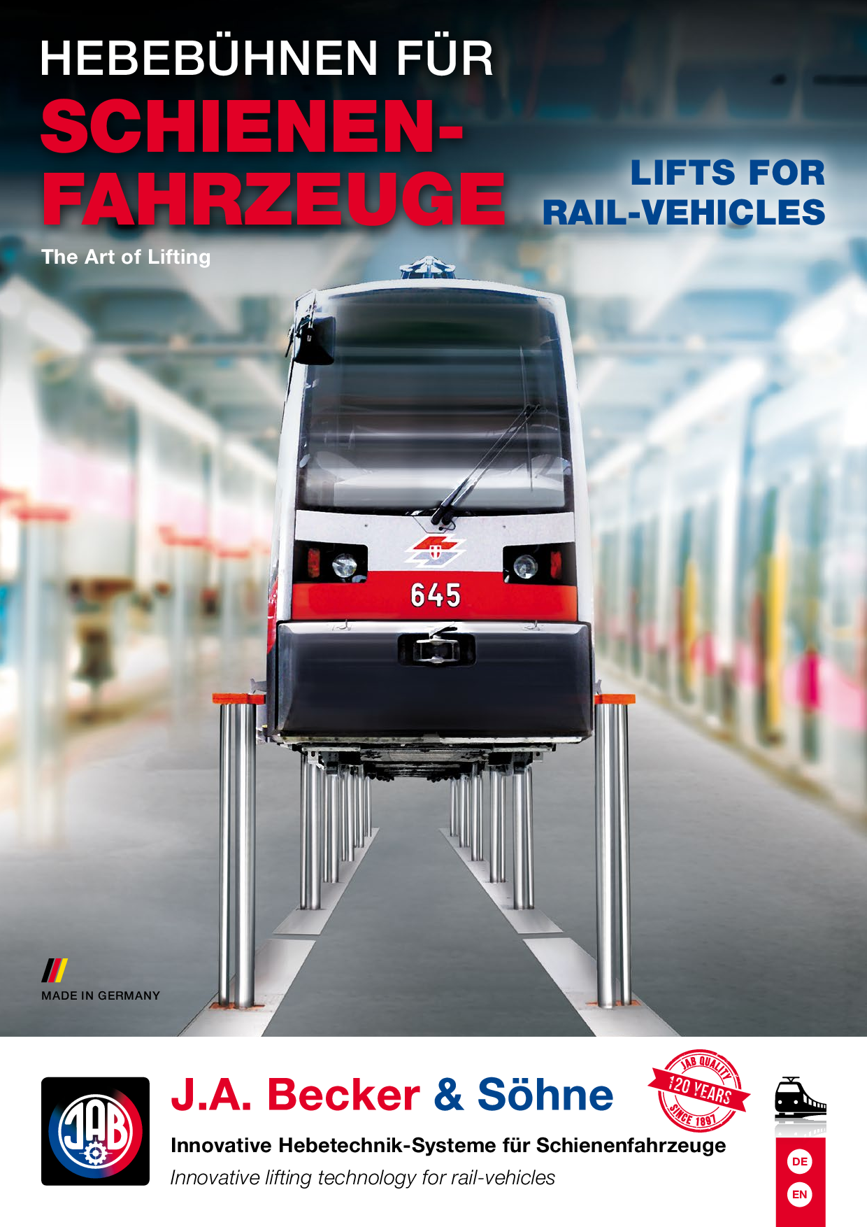 Eine Hebebühne für Schienenfahrzeuge mit einem Schienenfahrzeug, das angehoben wird, umgeben von technischen Details und Informationen.